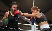 10 December 2010; Christina McMahon, left, in action against Polina Teucheva, during their Bantamweight title bout. Dolphil Promotions Fight Night - The Prides Path to Glory - Undercard, National Basketball Arena, Tallaght, Dublin. Picture credit: David Maher / SPORTSFILE