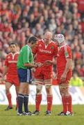 12 December 2010; Referee Christophe Berdos speaks to Munster captain Denis Leamy, right, and Paul O'Connell before sending off O'Connell following an incident with Jonathan Thomas, Ospreys. Heineken Cup Pool 3 - Round 3, Munster v Ospreys, Thomond Park, Limerick. Picture credit: Diarmuid Greene / SPORTSFILE