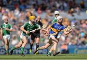 4 September 2016; Ger Browne of Tipperary in action against Darragh Carroll, left and Josh Adams of Limerick, right during the Electric Ireland GAA Hurling All-Ireland Minor Championship Final in Croke Park, Dublin.  Photo by Eóin Noonan/Sportsfile