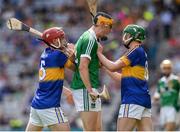4 September 2016; Brian Ryan of Limerick, centre, confronts Paddy Cadell, right, of Tipperary, during the Electric Ireland GAA Hurling All-Ireland Minor Championship Final in Croke Park, Dublin.  Photo by Seb Daly/Sportsfile