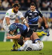 12 December 2010; Sean O'Brien, Leinster, is tackled by Brock James, 10, and Sione Lauaki, ASM Clermont Auvergne. Heineken Cup Pool 2 - Round 3, ASM Clermont Auvergne v Leinster, Stade Marcel Michelin, Clermont, France. Picture credit: Stephen McCarthy / SPORTSFILE