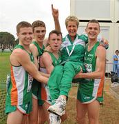 12 December 2010; Ireland U23 men's team, from left, David Rooney, Michael Mulhare, Brendan O'Neill and David McCarthy lift team manager Ann Keenan Buckley after they had secured the team gold medal. 17th SPAR European Cross Country Championships, Albufeira, Portugal. Picture credit: Brendan Moran / SPORTSFILE