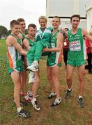 12 December 2010; Ireland U23 men's team, from left, David Rooney, Michael Mulhare, Brendan O'Neill, David McCarthy and John Coghlan lift team manager Ann Keenan Buckley after they had secured the team gold medal. 17th SPAR European Cross Country Championships, Albufeira, Portugal. Picture credit: Brendan Moran / SPORTSFILE