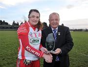 12 December 2010; Pat Quill, President, Cumann Peil Gael na mBan, presents Annie Walsh, Inch Rovers, Cork, with the player of the match trophy. Tesco All-Ireland Senior Ladies Football Club Championship Final, Carnacon, Mayo v Inch Rovers, Cork, Leahy Park, Cashel, Tipperary. Picture credit: David Maher / SPORTSFILE