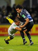 12 December 2010; Isa Nacewa, Leinster, is tackled by Ti'i Paulo, ASM Clermont Auvergne. Heineken Cup Pool 2 - Round 3, ASM Clermont Auvergne v Leinster, Stade Marcel Michelin, Clermont, France. Picture credit: Stephen McCarthy / SPORTSFILE