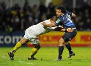 12 December 2010; Isa Nacewa, Leinster, is tackled by Ti'i Paulo, ASM Clermont Auvergne. Heineken Cup Pool 2 - Round 3, ASM Clermont Auvergne v Leinster, Stade Marcel Michelin, Clermont, France. Picture credit: Stephen McCarthy / SPORTSFILE