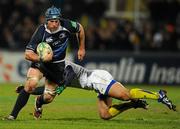 12 December 2010; Sean O'Brien, Leinster, is tackled by  Brock James, ASM Clermont Auvergne. Heineken Cup Pool 2 - Round 3, ASM Clermont Auvergne v Leinster, Stade Marcel Michelin, Clermont, France. Picture credit: Stephen McCarthy / SPORTSFILE