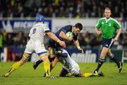 12 December 2010; Eoin O'Malley, Leinster, is tackled by Brock James and Julien Bonnaire, left, ASM Clermont Auvergne. Heineken Cup Pool 2 - Round 3, ASM Clermont Auvergne v Leinster, Stade Marcel Michelin, Clermont, France. Picture credit: Stephen McCarthy / SPORTSFILE