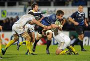 12 December 2010; Dominic Ryan, Leinster, is tackled by ASM Clermont Auvergne players, from left, Alexandre Lapandry, Brock James and Ti'i Paulo. Heineken Cup Pool 2 - Round 3, ASM Clermont Auvergne v Leinster, Stade Marcel Michelin, Clermont, France. Picture credit: Stephen McCarthy / SPORTSFILE