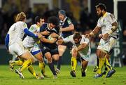 12 December 2010; Isa Nacewa, Leinster, is tackled by ASM Clermont Auvergne players, from left, Aurélien Rougerie, Lionel Faure, Gonzalo Canale and Sione Lauaki. Heineken Cup Pool 2 - Round 3, ASM Clermont Auvergne v Leinster, Stade Marcel Michelin, Clermont, France. Picture credit: Stephen McCarthy / SPORTSFILE