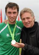 12 December 2010; Eamonn Coghlan with his son John and the team gold medal John won in the Men's U23 race. 17th SPAR European Cross Country Championships, Albufeira, Portugal. Picture credit: Brendan Moran / SPORTSFILE