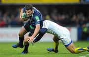 12 December 2010; Fergus McFadden, Leinster, is tackled by Thomas Domingo, ASM Clermont Auvergne. Heineken Cup Pool 2 - Round 3, ASM Clermont Auvergne v Leinster, Stade Marcel Michelin, Clermont, France. Picture credit: Stephen McCarthy / SPORTSFILE