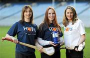 14 December 2010; Leading camogie stars and broadcasting personalities are uniting behind the efforts of an Irish charity, The Hope Foundation, to raise funds for the street and slum children of Calcutta. The partnership 'Camogie for Hope' will work to raise awareness of the work carried out by the charity and liaise on select fundraising initiatives including a charity 'All Stars' camogie match. Furthermore a fundraising run in Calcutta, the 'Kolkatta 10k' is taking place in the Indian city in March, with further information available on www.hopefoundation.ie . Pictured at the launch is Alison O'Brien, The Hope Foundation, with Kilkenny camogie star Elaine Alyward, left, and Evanne Ni Chuillin, RTE, right. Camogie Association & The Hope Foundation Photocall, Croke Park, Dublin. Picture credit: Brian Lawless / SPORTSFILE