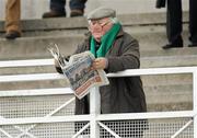 15 December 2010; A punter reads the form in a newspaper before The John Durkan Memorial Punchestown Steeplechase. Fairyhouse Racecourse, Fairyhouse, Co. Meath. Picture credit: Barry Cregg / SPORTSFILE