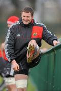 15 December 2010; Munster's Donnacha Ryan stretches during squad training ahead of their Heineken Cup Pool 3, Round 4, match against Ospreys on Saturday. Munster Rugby squad training, Cork Institute of Technology campus, Bishopstown, Cork. Picture credit: Diarmuid Greene / SPORTSFILE