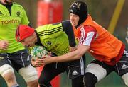 15 December 2010; Munster's Peter Stringer is tackled by Brian O'Meara in action during squad training ahead of their Heineken Cup Pool 3, Round 4, match against Ospreys on Saturday. Munster Rugby squad training, Cork Institute of Technology campus, Bishopstown, Cork. Picture credit: Diarmuid Greene / SPORTSFILE