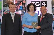 15 December 2010; TG4 celebrated their tenth year as sponsor of the Ladies Football Championships last night at a Banquet in Croke Park and in honour of the association between TG4 and Ladies Football, the TG4 Ladies Football Team of the Decade was announced. Receiving her award as a member of the team from Pat Quill, President, Cumann Peil Gael na mBan and Pol O Gallchoir, Ceannasai, TG4, is Cliodhna O'Connor, of Dublin. TG4 Ladies Football Team of the Decade Banquet, Croke Park, Dublin. Picture credit: Brendan Moran / SPORTSFILE