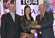 15 December 2010; TG4 celebrated their tenth year as sponsor of the Ladies Football Championships last night at a Banquet in Croke Park and in honour of the association between TG4 and Ladies Football, the TG4 Ladies Football Team of the Decade was announced. Receiving her award as a member of the team from Pat Quill, right, President, Cumann Peil Gael na mBan and Pol O Gallchoir, Ceannasai, TG4, is Christina Heffernan of Mayo. TG4 Ladies Football Team of the Decade Banquet, Croke Park, Dublin. Picture credit: Brendan Moran / SPORTSFILE