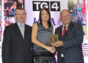 15 December 2010; TG4 celebrated their tenth year as sponsor of the Ladies Football Championships last night at a Banquet in Croke Park and in honour of the association between TG4 and Ladies Football, the TG4 Ladies Football Team of the Decade was announced. Receiving her award as a member of the team from Pat Quill, right, President, Cumann Peil Gael na mBan and Pol O Gallchoir, Ceannasai, TG4, is Tracey Lawlor of Laois. TG4 Ladies Football Team of the Decade Banquet, Croke Park, Dublin. Picture credit: Brendan Moran / SPORTSFILE