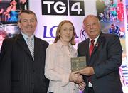 15 December 2010; TG4 celebrated their tenth year as sponsor of the Ladies Football Championships last night at a Banquet in Croke Park and in honour of the association between TG4 and Ladies Football, the TG4 Ladies Football Team of the Decade was announced. Receiving her award as a member of the team from Pat Quill, right, President, Cumann Peil Gael na mBan and Pol O Gallchoir, Ceannasai, TG4, is Geraldine O'Shea of Kerry. TG4 Ladies Football Team of the Decade Banquet, Croke Park, Dublin. Picture credit: Brendan Moran / SPORTSFILE