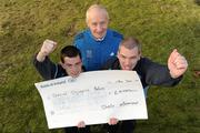 17 December 2010; Jim Augney, Race Director, Lifestyle Sports - Adidas Dublin City Marathon presents Special Olympics athletes Gary O'Brien, left, from Artane, Co. Dublin, and James Murphy, from Portmarnock, Co. Dublin, with a cheque for €6000, money raised as a result of this year’s Lifestyle Sports - Adidas Dublin City Marathon. Special Olympics Ireland was one of two nominated charities to benefit from this year’s marathon. Special Olympics Ireland, Park House, North Circular Road, Dublin. Photo by Sportsfile