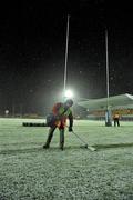 17 December 2010; Michael Guest, a member of the groundstaff, clears the snow off the end line before the start of the game. Amlin Challenge Cup, Pool 1, Round 3, Connacht v Harlequins, Sportsground, Galway. Picture credit: David Maher / SPORTSFILE