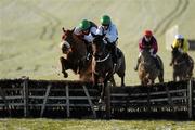 18 December 2010; Mackeys Forge, right, with Roger Loughran up, jumps the last ahead of Silver Lord, with Davy Condon up, on their way to winning the 2011 Navan Membership 'The Ideal Christmas Gift' Maiden Hurdle. Navan Racecourse, Proudstown, Navan, Co. Meath. Picture credit: Barry Cregg / SPORTSFILE