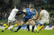 18 December 2010; Brian O'Driscoll, Leinster, is tackled by Brock James, left, and Davit Zirakashvili, ASM Clermont Auvergne. Heineken Cup, Pool 2, Round 4, Leinster v ASM Clermont Auvergne, Aviva Stadium, Lansdowne Road, Dublin. Picture credit: Brendan Moran / SPORTSFILE