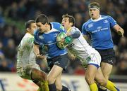 18 December 2010; Jonathan Sexton, Leinster, is tackled by Gavin Williams, right, and Brock James, ASM Clermont Auvergne. Heineken Cup, Pool 2, Round 4, Leinster v ASM Clermont Auvergne, Aviva Stadium, Lansdowne Road, Dublin. Picture credit: Brendan Moran / SPORTSFILE