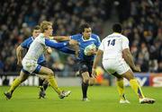 18 December 2010; Isa Nacewa, Leinster, is tackled by Aurelien Rougerie and Napolioni Nalaga, right, ASM Clermont Auvergne. Heineken Cup, Pool 2, Round 4, Leinster v ASM Clermont Auvergne, Aviva Stadium, Lansdowne Road, Dublin. Picture credit: Brendan Moran / SPORTSFILE
