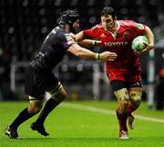 18 December 2010; David Wallace, Munster, is tackled by Marty Holah, Ospreys. Heineken Cup, Pool 3, Round 4, Ospreys v Munster, Liberty Stadium, Swansea, Wales. Picture credit: Stephen McCarthy / SPORTSFILE