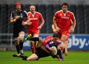 18 December 2010; Richard Fussell, Ospreys, is tackled by Doug Howlett, Munster. Heineken Cup, Pool 3, Round 4, Ospreys v Munster, Liberty Stadium, Swansea, Wales. Picture credit: Stephen McCarthy / SPORTSFILE