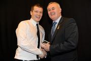 19 December 2010; Dublin's Graham Bedford is presented with his All-ireland U-21 medal by Uachtarán CLG Criostóir Ó Cuana. The Officers Mess, Baldonnell, Dublin. Picture credit: Barry Cregg / SPORTSFILE
