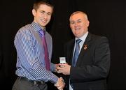 19 December 2010; Dublin's Mark Coughlan is presented with his All-Ireland U-21 medal by Uachtarán CLG Criostóir Ó Cuana. The Officers Mess, Baldonnell, Dublin. Picture credit: Barry Cregg / SPORTSFILE