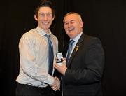 19 December 2010; Dublin's Nicholas Devereux is presented with his All-Ireland U-21 medal by Uachtarán CLG Criostóir Ó Cuana. The Officers Mess, Baldonnell, Dublin. Picture credit: Barry Cregg / SPORTSFILE