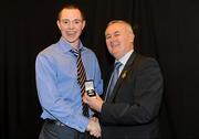 19 December 2010; Dublin's Dean Rock is presented with his All-Ireland U-21 medal by Uachtarán CLG Criostóir Ó Cuana. The Officers Mess, Baldonnell, Dublin. Picture credit: Barry Cregg / SPORTSFILE