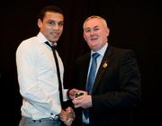 19 December 2010; Dublin's Craig Dias is presented with his All-Ireland U-21 medal by Uachtarán CLG Criostóir Ó Cuana. The Officers Mess, Baldonnell, Dublin. Picture credit: Barry Cregg / SPORTSFILE
