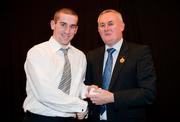 19 December 2010; Dublin's Gerry Seaver is presented with his All-Ireland U-21 medal by Uachtarán CLG Criostóir Ó Cuana. The Officers Mess, Baldonnell, Dublin. Picture credit: Barry Cregg / SPORTSFILE