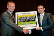 19 December 2010; Former WBA Super Bantamweight World Champion Bernard Dunne is presented with a framed picture of the 2010 Dublin All-Ireland U-21 squad by Dublin manager Jim Gavin. The Officers Mess, Baldonnell, Dublin. Picture credit: Barry Cregg / SPORTSFILE