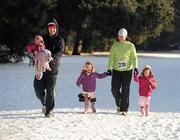 25 December 2010; The Foley family, from Clontarf, Dublin, Maggie, eight months, Alan, twins Ella and Liv, four years, and Siobhán, after taking part in the Raheny Shamrock Athletic Club 'Christmas Morning Dash down the Avenue' in aid of Goal. Annual Goal Mile,St Annes Park, Raheny, Dublin. Picture credit: Ray McManus / SPORTSFILE