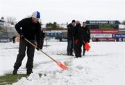26 December 2010; David Humphreys, Ulster Rugby Operations Director, helps the remove the snow from the Ravenhill pitch ahead of Ulster's Celtic League clash against Leinster, on Monday 27th December. Ravenhill, Belfast, Antrim. Picture credit: John Dickson / SPORTSFILE