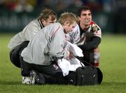 27 December 2010; Injury worries for Ulster as scrum half Ruan Pienaar is treated by Physio Gareth Robinson and Doctor David Irwin. Celtic League, Ulster v Leinster, Ravenhill Park, Belfast. Picture credit: John Dickson / SPORTSFILE