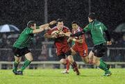27 December 2010; Denis Hurley, Munster, is tackled by Sean Cronin, left, and Rob Sweeney, Connacht. Celtic League, Connacht v Munster, Sportsground, Galway. Picture credit: Diarmuid Greene / SPORTSFILE