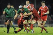 27 December 2010; Mike McComish, Connacht, is tackled by Donnacha Ryan, left, and Niall Ronan, Munster. Celtic League, Connacht v Munster, Sportsground, Galway. Picture credit: Diarmuid Greene / SPORTSFILE