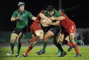 27 December 2010; Jamie Hagan, supported by Mike McComish, Connacht, is tackled by Tommy O'Donnell, left, and Dave Ryan, Munster. Celtic League, Connacht v Munster, Sportsground, Galway. Picture credit: Diarmuid Greene / SPORTSFILE