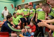 5 September 2016; Ned Predergast, age 9, from Kildare Town, with Tipperary hurler John O'Dwyer, left, and his team-mates and the Irish Press cup during the the All-Ireland winning team visit to Our Lady's Children's Hospital, Crumlin, in Dublin. Photo by Piaras Ó Mídheach/Sportsfile