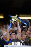 4 September 2016; Michael Cahill of Tipperary lifts the trophy following his team's victory in the GAA Hurling All-Ireland Senior Championship Final match between Kilkenny and Tipperary at Croke Park in Dublin. Photo by Seb Daly/Sportsfile