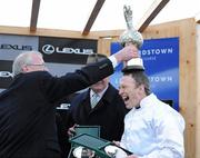 28 December 2010; Owner Robert Bagnall puts the Lexus trophy on the head of jockey Paul Carberry after winning The Lexus Steeplechase with Pandorama. Leopardstown Christmas Racing Festival 2010, Leopardstown Racecourse, Leopardstown, Dublin. Picture credit: Matt Browne / SPORTSFILE