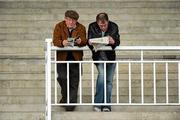 29 December 2010; Punters read up on the form ahead of the opening race. Leopardstown Christmas Racing Festival 2010, Leopardstown Racecourse, Leopardstown, Dublin. Picture credit: Stephen McCarthy / SPORTSFILE