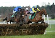 29 December 2010; Hurricane Fly, left, with Paul Townend up, jumps the last with eventual third place Luska Lad, 2, with Andrew McNamara up, and eventual second place Solwith, with Davy Russell up, on their way to winning The paddypower.com iPhone App December Festival Hurdle. Leopardstown Christmas Racing Festival 2010, Leopardstown Racecourse, Leopardstown, Dublin. Picture credit: Matt Browne / SPORTSFILE